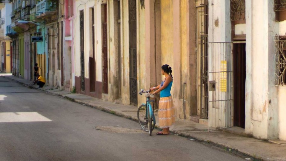 Cuba - Woman on Street with Bike